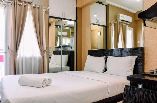 Photo 1 - Cozy Stay Studio Room at Green Pramuka City Apartment