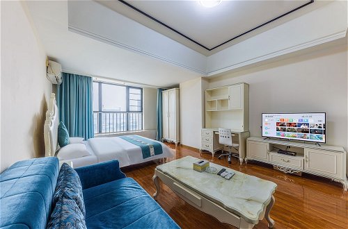 Foto 5 - Home Inn Huayi Apartment