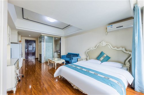 Foto 9 - Home Inn Huayi Apartment