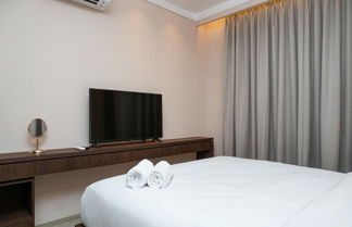 Photo 2 - Minimalist and Cozy 2BR Citralake Suites Apartment