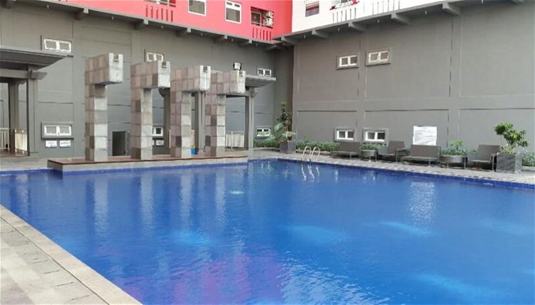 Photo 1 - Homey 1BR with Spacious Living Room and Sofa Bed Green Pramuka Apartment