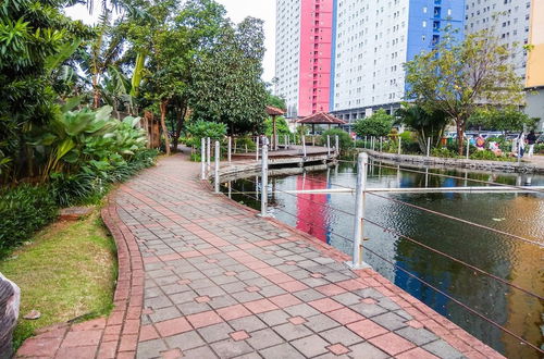 Photo 29 - Homey 1BR with Spacious Living Room and Sofa Bed Green Pramuka Apartment