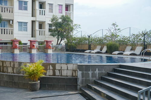 Photo 11 - Homey And Simply Look Studio Belmont Residence Puri Apartment