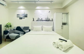 Photo 1 - Modern Design And Cozy Studio At Bassura City Apartment