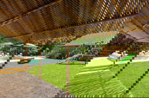 Photo 19 - Spacious Farmhouse With Private Heated Pool in a Rustic Garden