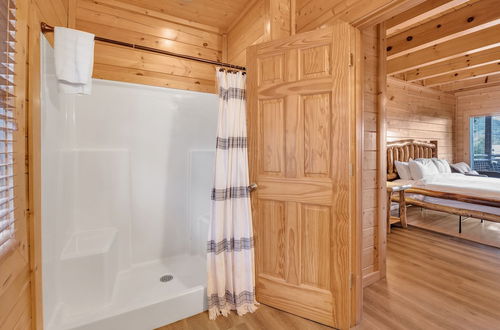 Photo 12 - Cabin w/ Theater, Games & Hot Tub! Sleeps 30