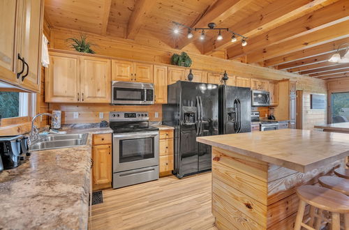 Photo 31 - Cabin w/ Theater, Games & Hot Tub! Sleeps 30