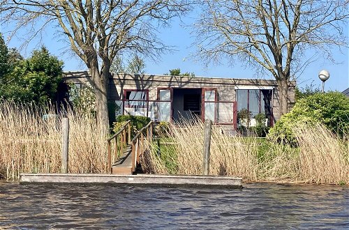 Photo 1 - 2 Pers. House König Lakeside of the Lauwersmeer With own Fishing Pier Sauna