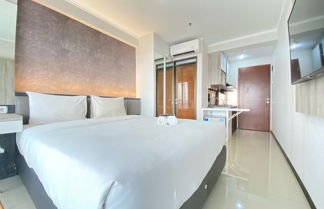 Photo 2 - Cozy Studio Apartment At Gateway Pasteur