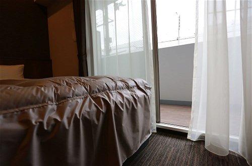 Foto 6 - The Base Sakaihigashi Apartment Hotel