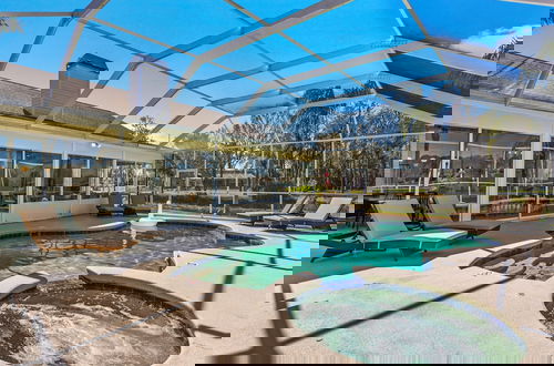 Photo 49 - Luxe Waterfront Hideaway w Pool & Pirate Ship Dock