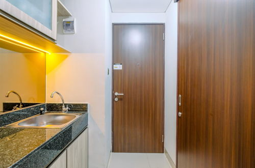 Photo 6 - Warm And Minimalist Studio Room Transpark Cibubur Apartment