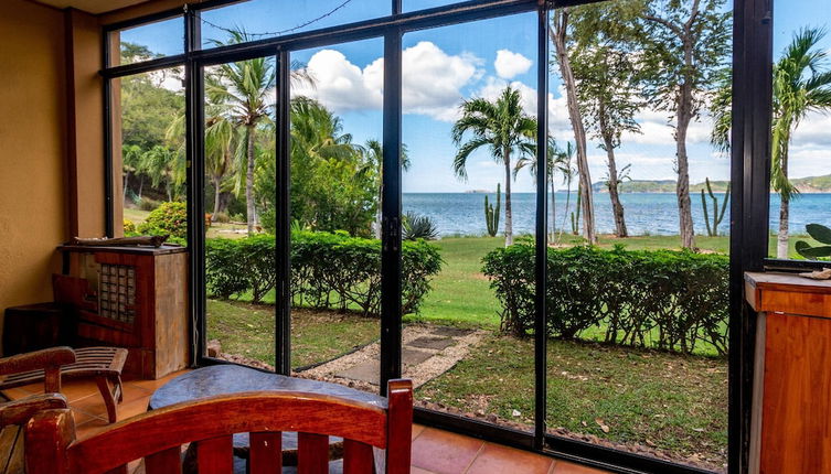 Photo 1 - Warm Interiors and Orange Hues on Ground Floor in Front of Beach