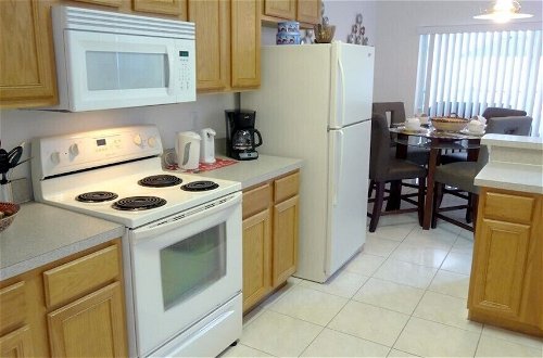 Photo 12 - 5 Beds With Private Pool Near Disney Parks 4703 5 Bedroom Home by RedAwning