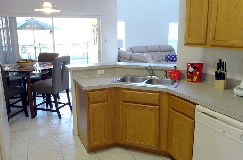 Photo 13 - 5 Beds With Private Pool Near Disney Parks 4703 5 Bedroom Home by RedAwning