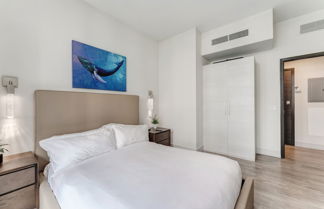 Photo 2 - Condo Close to the Beach With Rooftop Pool & Gym