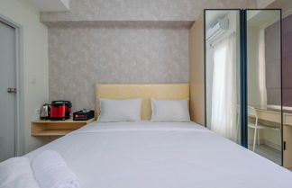Photo 3 - Sophisticated Studio Room At Podomoro Golf View Apartment By Travelio