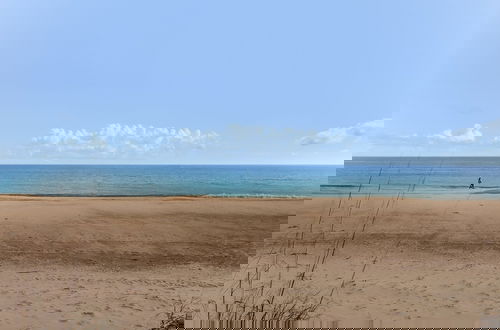 Photo 33 - Roomy Chalet-Style Beachfront Condo with Private Beach Access by RedAwning
