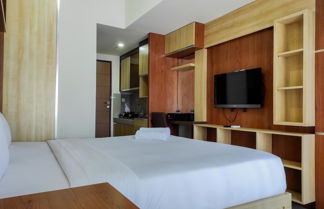 Photo 3 - Cozy Studio At Vida View Makassar Apartment