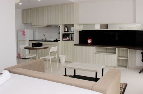 Photo 18 - Comfort And Minimalist Studio At Azalea Suites Apartment