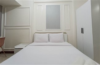 Photo 3 - White And Cozy Studio At Vida View Makassar Apartment