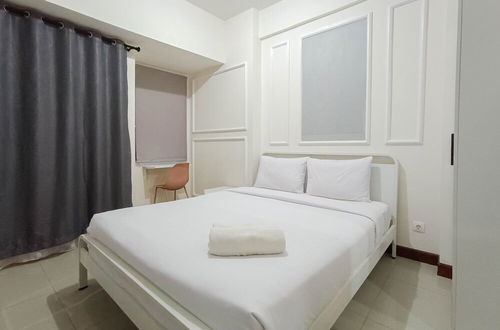 Photo 1 - White And Cozy Studio At Vida View Makassar Apartment