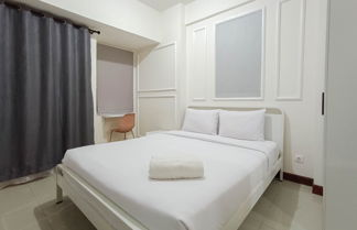 Photo 1 - White And Cozy Studio At Vida View Makassar Apartment