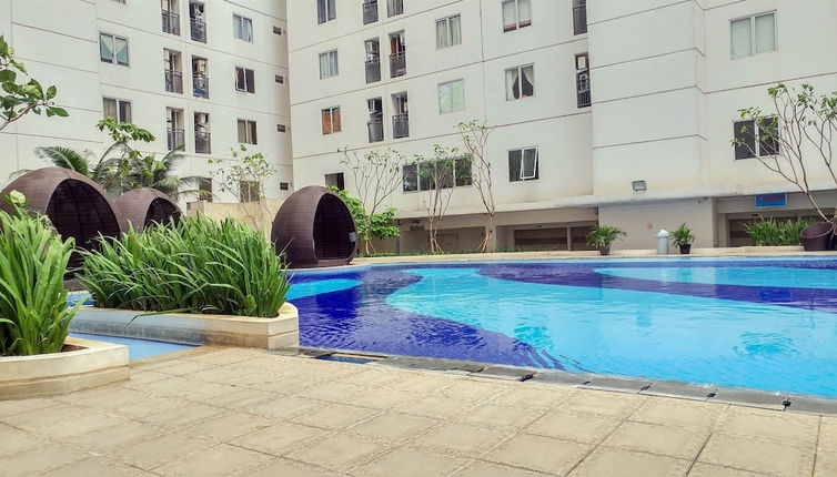 Photo 1 - Comfy 2BR Bassura City Apartment Near Bassura Mall