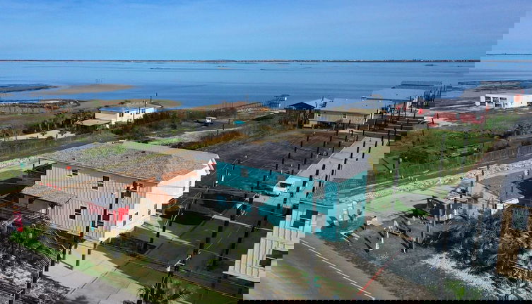 Photo 1 - 6bdr Bay Haven w/ Shared Waterfront Pool + Boat Dock Keeper Trout by Avantstay