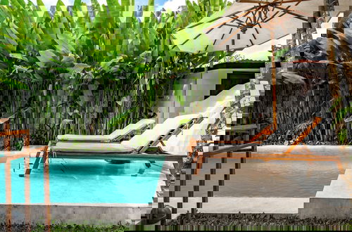 Photo 32 - Moonlight EVDEkimi - Stylish 2BR escape with Tropical garden and Pool