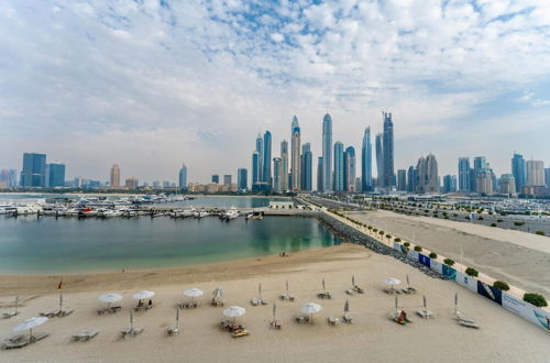 Photo 2 - Deluxe 3BR Apt w Dubai Marina Vws Beach Access