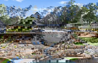 Photo 1 - Gray Fox Lodge by Avantstay Waterslide Pool Theater Sleeps 23