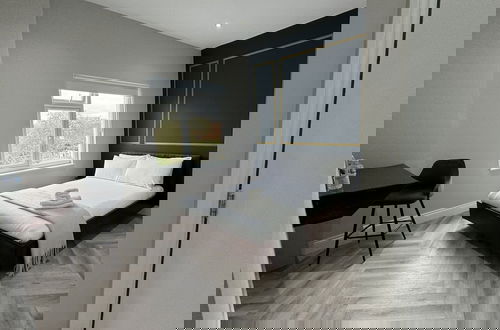 Foto 5 - London Studios and Suites
