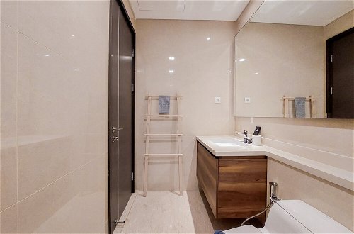 Photo 10 - Minimalist 1Br With Study Room At Marigold Nava Park Apartment