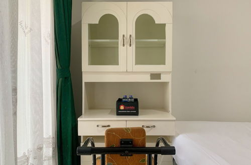 Foto 8 - Minimalist And High Floor Studio Room At Gold Coast Apartment