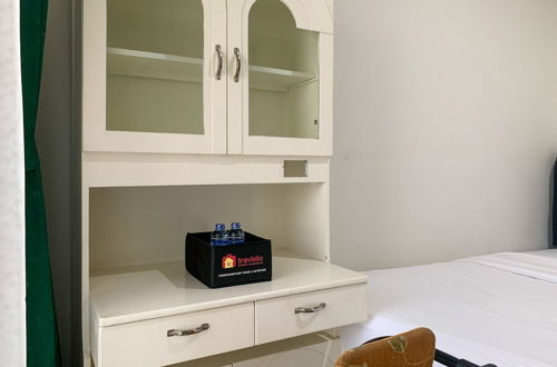 Foto 9 - Minimalist And High Floor Studio Room At Gold Coast Apartment
