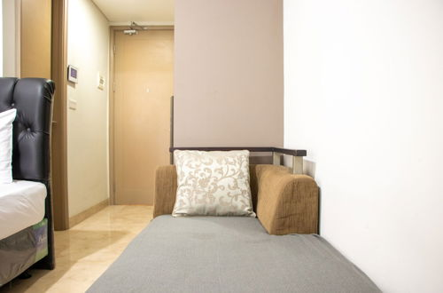 Foto 12 - Minimalist And High Floor Studio Room At Gold Coast Apartment