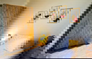 Photo 3 - Modern and Cozy Apartment Near Shopping Malls
