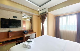 Photo 1 - Cozy Studio Room At Oasis Cikarang Apartment