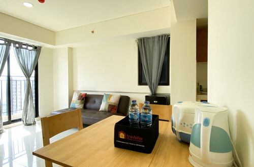Foto 11 - Restful And Tidy 2Br At 21St Floor Meikarta Apartment