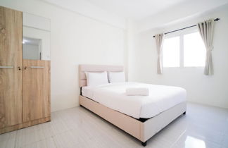 Photo 1 - Best Choice And Homey 2Br At Puncak Dharmahusada Apartment