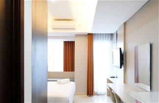 Foto 1 - Luxurious Studio With Long Golf View At Grand Sungkono Lagoon Apartment