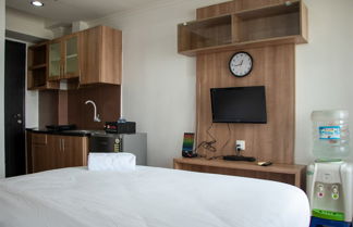 Photo 3 - Nice And Comfort Studio Apartment At Belmont Residence Puri