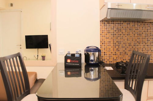 Photo 10 - Nice And Comfy 2Br At Bassura City Apartment