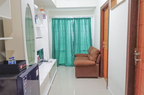 Photo 14 - Nice And Homey 2Br At Vida View Makasar Apartment