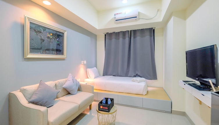 Photo 1 - Warm And Cozy Studio Evenciio Apartment Margonda Near Ui