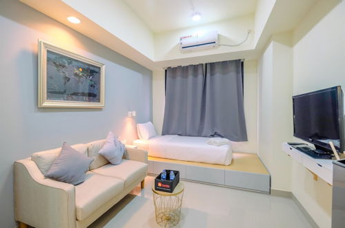 Foto 1 - Warm And Cozy Studio Evenciio Apartment Margonda Near Ui