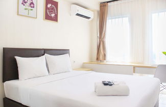 Photo 1 - Comfortable Patraland Urbano Studio Apartment Near Train Station