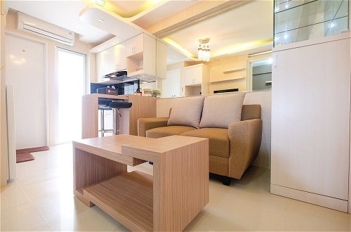 Photo 1 - Modern Minimalist 2 Bedrooms at Bassura City Apartment By Travelio
