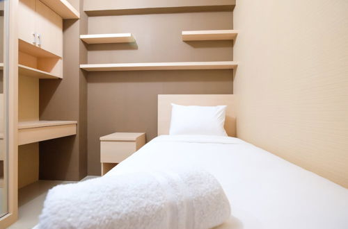 Photo 3 - Modern Minimalist 2 Bedrooms at Bassura City Apartment By Travelio